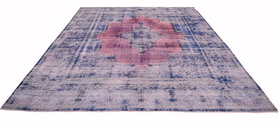 An vintage overdyed carpet with a classical oriental carpet design with vestiges of traditional border and lobed medallion in a stunning magentta Distressed  handwoven pile that has been re-dyed with deep blues and raspberry pinks. 