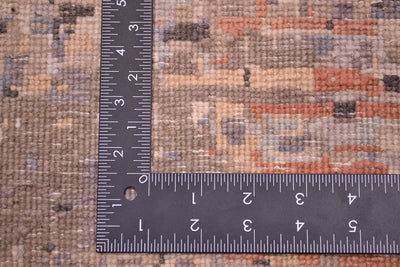 Reverse of handwoven Indian Carpet showing cotton wefts and back of knot of woollen and silk pile. Soft greys, light blues, taupes and light gold. 