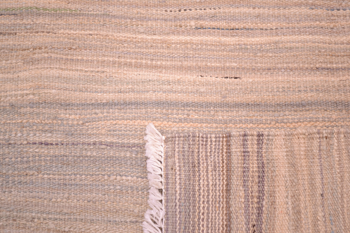 Reversable pastel abrash modern kilim handwoven in Afghanistan showing linear modern design with soft grey and creams  woven with handpsun and hand-dyed woollen yarn woven onto cotton foundation warps.