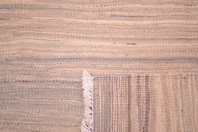 Reversable pastel abrash modern kilim handwoven in Afghanistan showing linear modern design with soft grey and creams  woven with handpsun and hand-dyed woollen yarn woven onto cotton foundation warps.