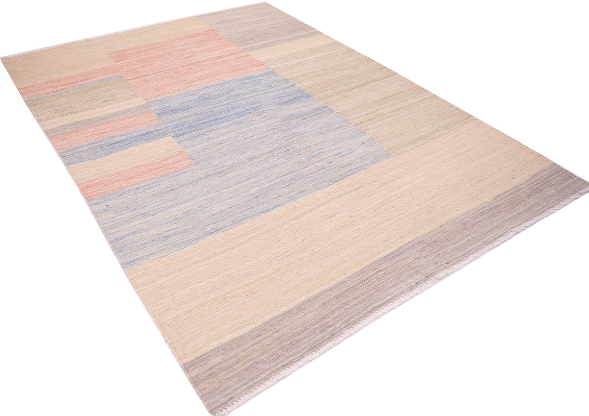 Angled overall view of handmade kilim made with natrual vegetable dyes with lineal design in blue, pink, grey and beige-cream. Woven on cotton warps.