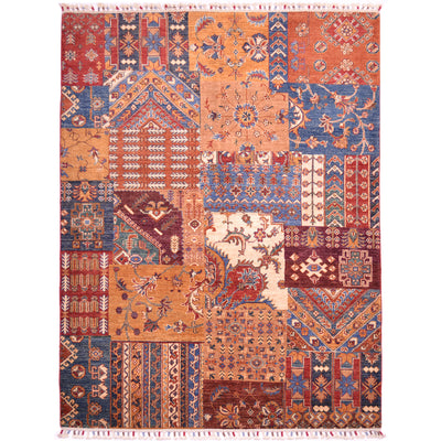 Patchwork design rug with all over design in colours of ochre, rust-red, burnt orange, blue, brown, green and cream. 