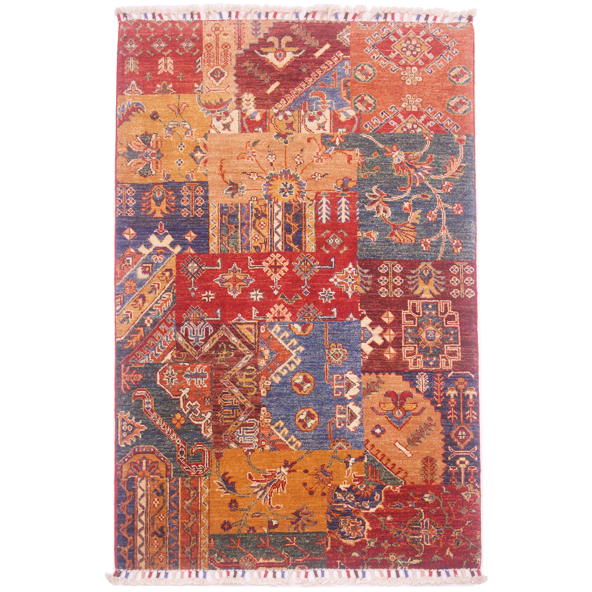 Hand-knotted wool pile Afghan Patchwork design rug with a mixed assortment of geometric patterns and colours including ochre, red, burnt orange, green, blue, and brown.