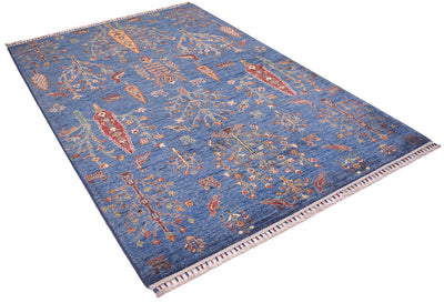 A rectangular blue Afghan pictorial area rug with an intricate traditional pattern in red, beige, and orange, featuring a fringed border on a white background.