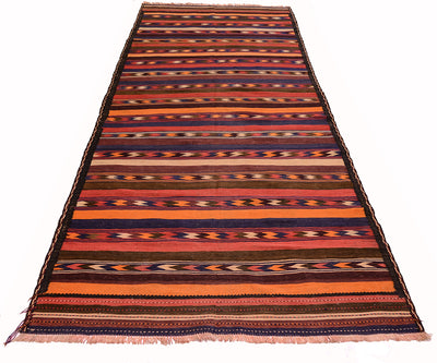 A rectangular vintage Afghan kilim area rug / wide runner with horizontal stripes and geometric patterns in orange, red, brown, black, and cream, shown flat against a white background.