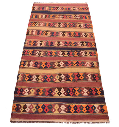 A handwoven rectangular kilim wool rug with a traditional geometric pattern, featuring horizontal stripes in red, orange, beige, brown, and dark blue, with fringed edges.