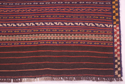 Vintage Kilim rug border with fringe and multicolor geometric bands in dark red