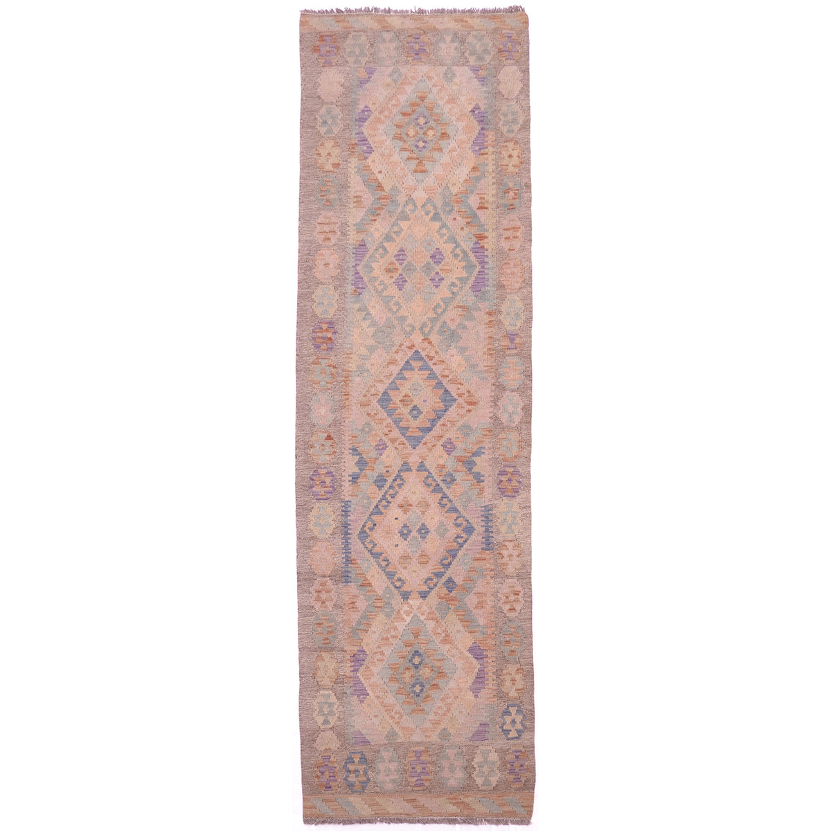 Handwoven soft colour Kilim runner with geometric design and faded washed out colours of beige, rust, green, blue and purple.