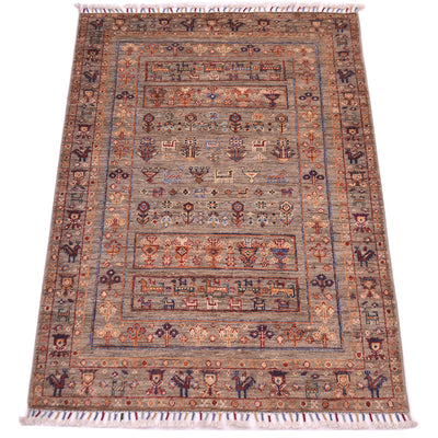 A rectangular hand-knotted fine Afghan Samarkand wool rug with a traditional geometric and floral pattern, featuring cream fringe on the top and bottom edges. The colour palette is dominated by warm grey-brown and detail tones in blue, ochre, rust and cream.