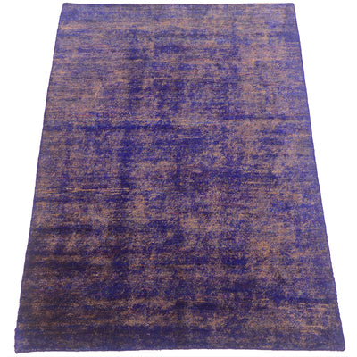 A rectangular sari silk area rug with a distressed, vintage-style pattern in deep purple and brown tones, shown flat against a white background.