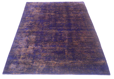 A rectangular area Sari Silk rug with textured pattern in deep purple and brown tones, shown flat against a solid white background.