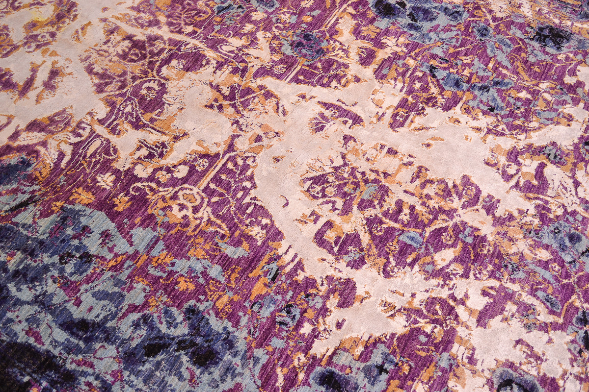 Abstract modern carpet with dynamic colours of black, indigo, blues, mauves and golden yellow white areas of art viscose silk.