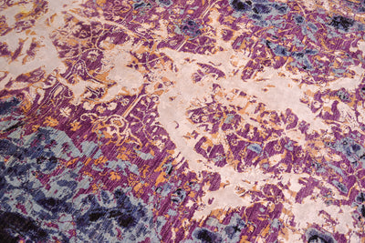 Abstract modern carpet with dynamic colours of black, indigo, blues, mauves and golden yellow white areas of art viscose silk.
