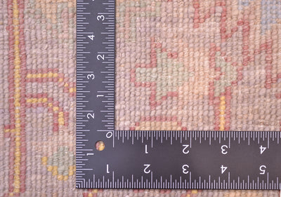 DEtail of reverse of rug showing handknotting of pure wool and soft tones created by natural vegetable dyes.