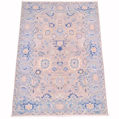 View of soft grey field of handmade Afghan Serapi Rug  with cloudband border with sfort light blue backgrouns, Additional colours include pink, duck- egg, cream, beige and yellow.