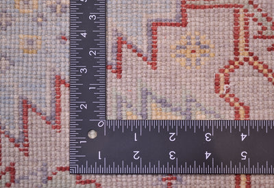 Back and reverse of Afghan Serapi design rug showing handknotting of soft grey field and geometric medallions.