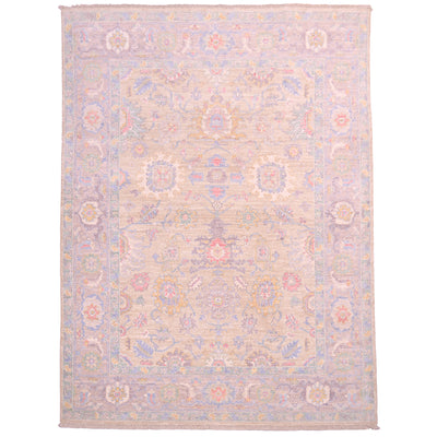 Pale Serapi rug with soft colours including a very light gold ground with all over floral design. Cloudband border with stylized leaves. 