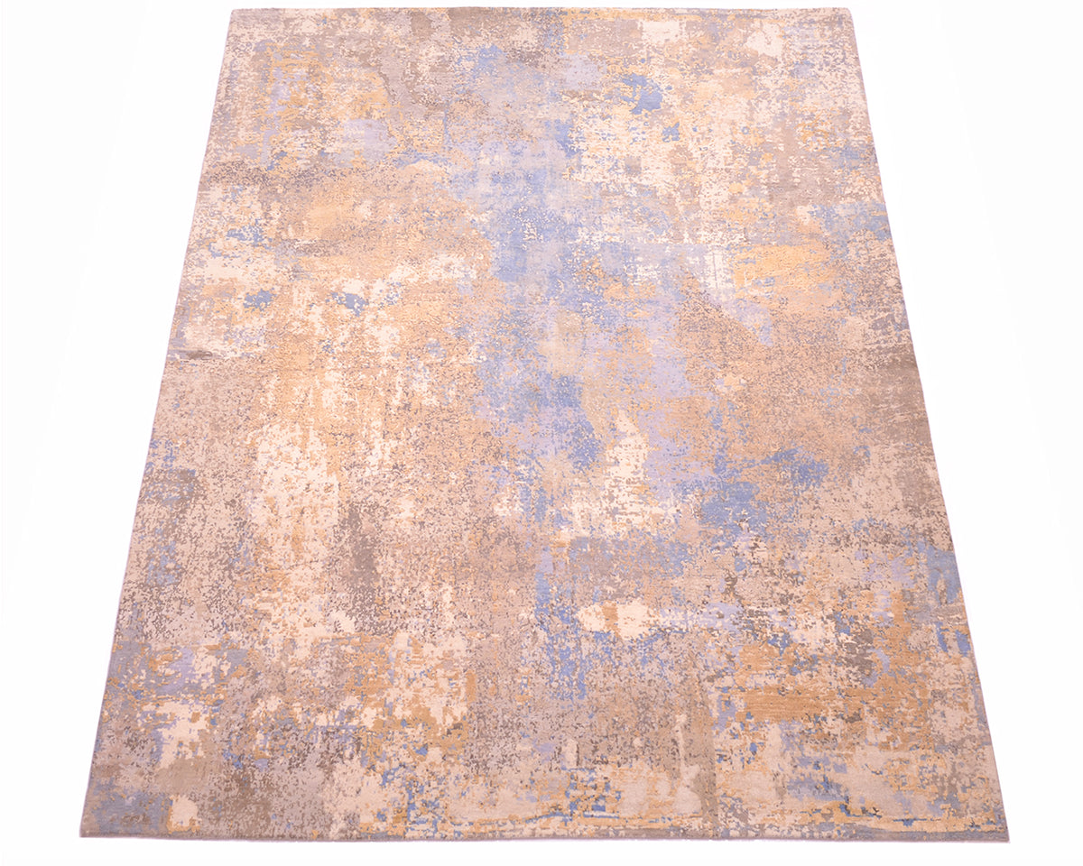 Overall view of  Indian handknotted carpet with pure wool and pure silk pile. Fragmented abstract blurred design with ligth blue, grey-blue, beige cream with  raised silk highlights of grey, golden cream and golden beige.