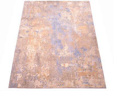 Overall view of  Indian handknotted carpet with pure wool and pure silk pile. Fragmented abstract blurred design with ligth blue, grey-blue, beige cream with  raised silk highlights of grey, golden cream and golden beige.
