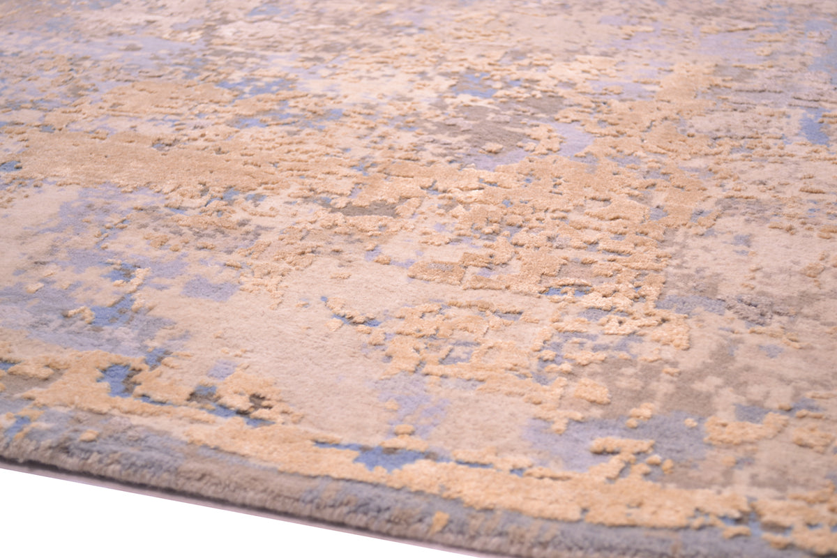 Detail of Indina carept with fine knotting of pure wool pileand substantial areas of pure handspun silk in golden creams and golden beiges.