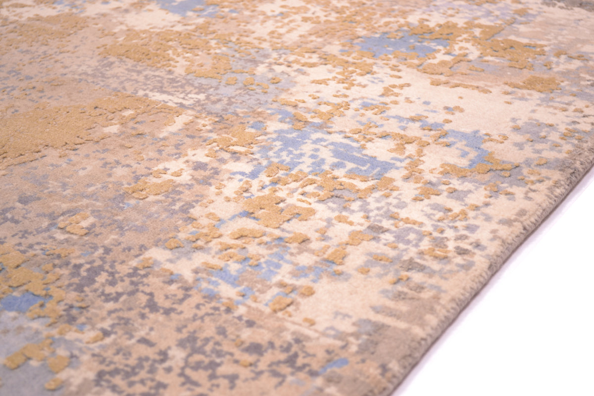 Detail of pure wool pile in cream, grey and clay-grey wih hints of sky blue. Higher level raised areas of handknotted golden cream silk ...to add texture and visual interest.
