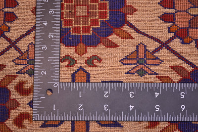 Kabul silk and wool rug close-up with measuring tape across the cream patterned surface