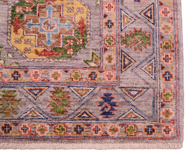 Corner detail of handmade Afghan handmade rug with traditional geometric framework and traditional guls with modern colours combinations. 