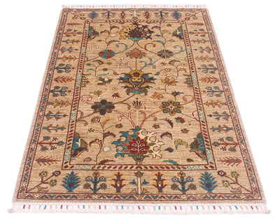 Persian design in all over floral field of afghan handmade rug with pure wool pile and golden beige field hues with contrasting colourful detailing and unfurling vines and stems connecting the botanical features.