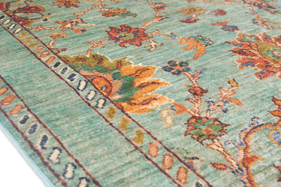 Close up detail of simple empty plain backgrond of main border framed with simple colourful geometric minor borders and contrasting highly floral field decoration.