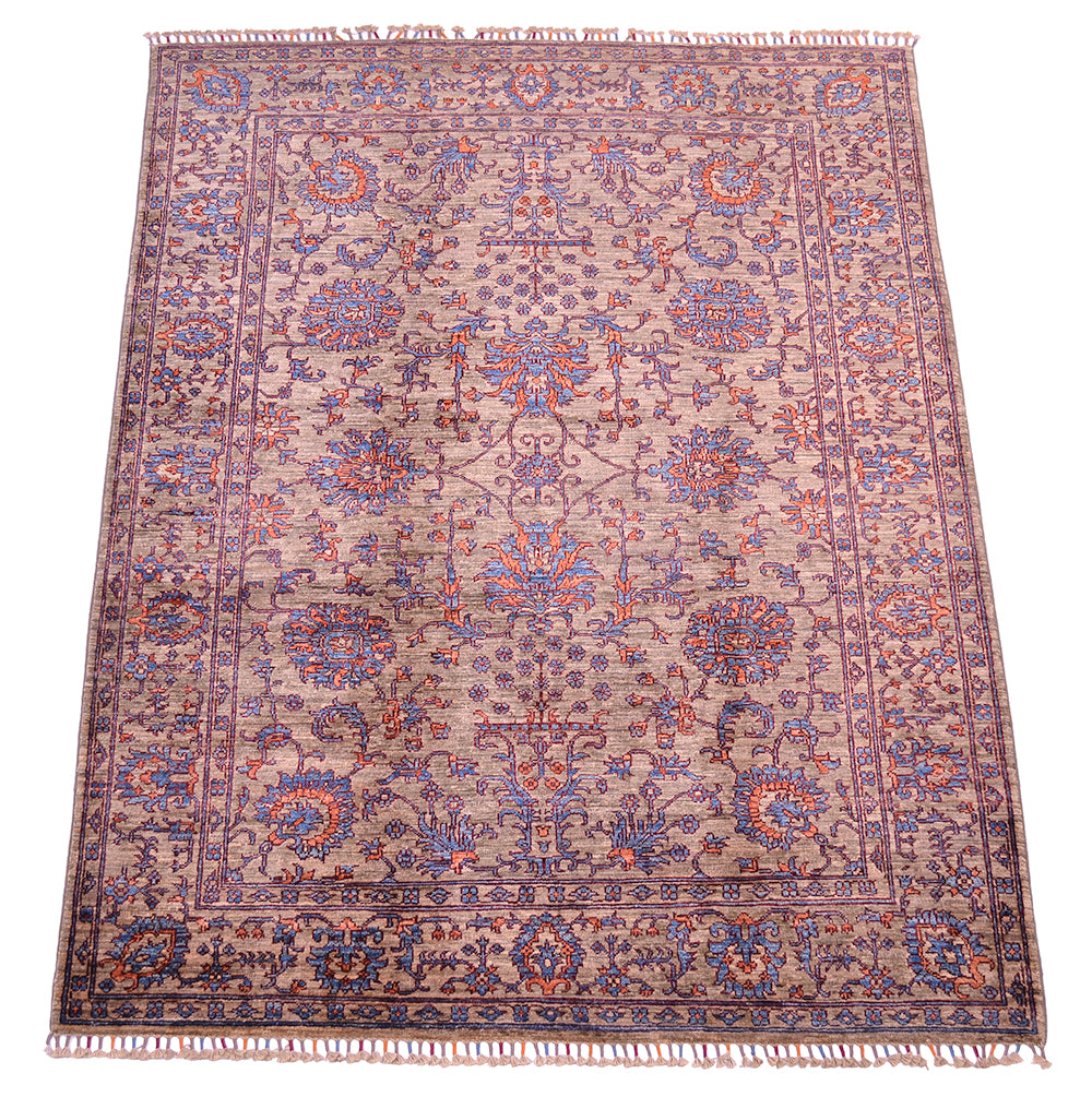 Floral design of handmade Sultani rug with flowerheads and palmettes with interconneting tendrils and hints of blue and orange throughout main field and border. Ground backgorund colour a soft grey neutral with brown earthy hues.
