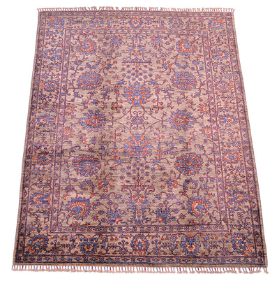 Floral design of handmade Sultani rug with flowerheads and palmettes with interconneting tendrils and hints of blue and orange throughout main field and border. Ground backgorund colour a soft grey neutral with brown earthy hues.