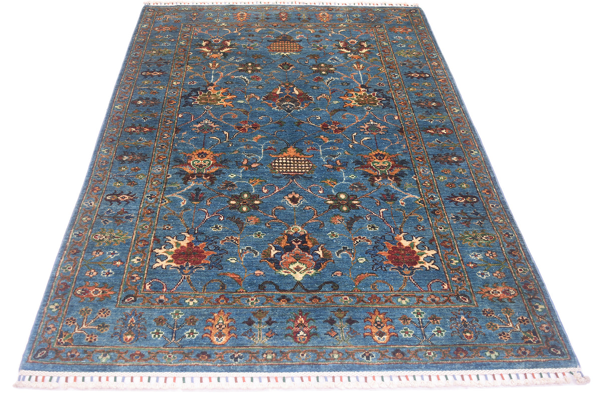 Rich coloration of blue and multicoloured Afghan sultani rug with contrasting colours in an all over floral design.
