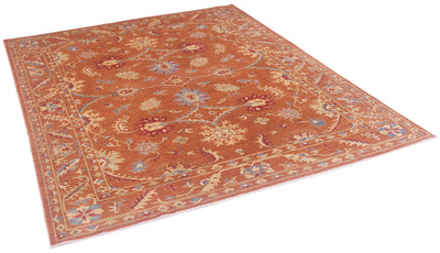 Angled view of Sultani carpet in modern colours with arabeques and scrolling vines with ornate flowerheads. Accents of red, blue and soft greens and yellows. 