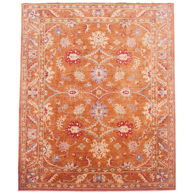 Cinnamon amber coloured Sultani carpet with  Persian floral designs in colours of cream, green,red and blue and light saffron cream.