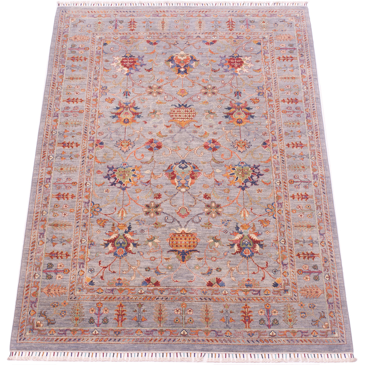 Stunning view of handknotted carpet with detailing in multiple colours with palmettes and pomegranates. Handwoven with natural vegetable dyes.