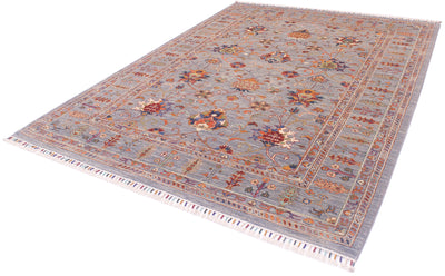 Angel view of handowven Sultaon carpet with cotton warp fringes bound with multiple colours. Grey field with hints of blue and variety of subtle colours.