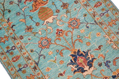 Close up and detail of main field of turquoise Afghan Rug with prominant palmette and pomegranate motifs with interconnecting rosettes and blossoms. 