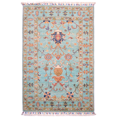 Turquoise Fine Afghan Sultani rug with  all over floral design with contratinb warm toned decotavie palmette and blossom designs.