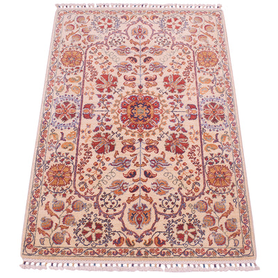 Cream rug with ornate red and blue floral motifs, central medallion, and fringe