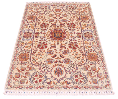 Cream Afghan rug with symmetrical red, blue and orange medallion design and short fringe