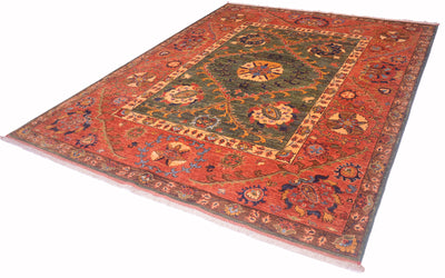 A traditional Afghan Suzani design handmade carpet with a complex floral and geometric pattern, featuring a dominant rust-red field, a dark green central medallion, and cream, blue, and orange accents, shown on a plain white background.