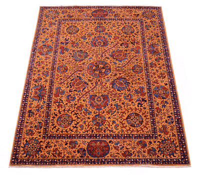 A traditional oriental Suzani area rug with an intricate floral and medallion pattern, featuring a warm amber field with navy blue, red, and beige details.