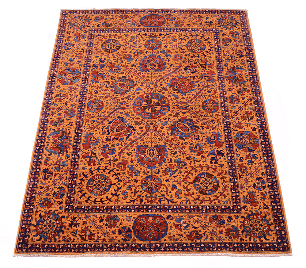 A traditional oriental Suzani area rug with an intricate floral and medallion pattern, featuring a warm amber field with navy blue, red, and beige details.