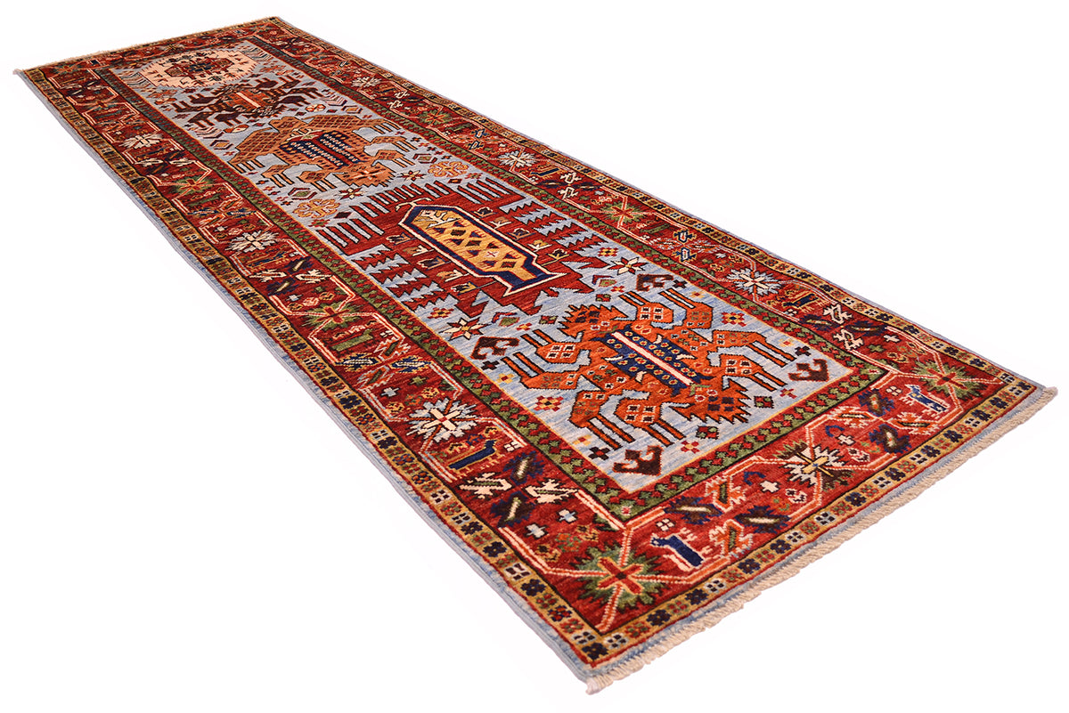 A 2.5m long rectangular antique style Afghan tribal runner rug with an intricate traditional pattern in light blue, red, orange, beige, and navy, shown from an elevated angle on a white background.