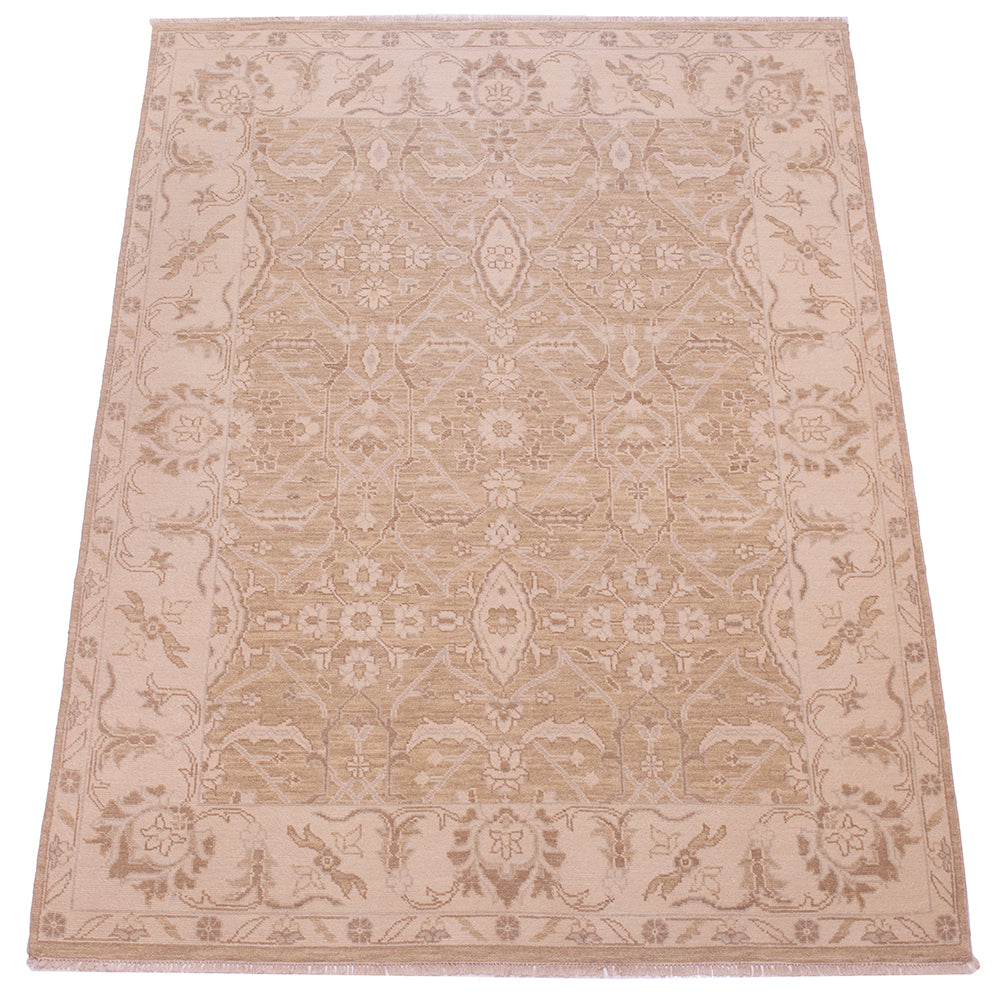 A rectangular tonal rug with a traditional ornamental pattern in shades of beige, tan, and light brown, shown flat against a white background.