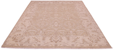 A tonal area rug with a traditional floral pattern in shades of beige and light brown, shown from a top-down perspective on a white background.