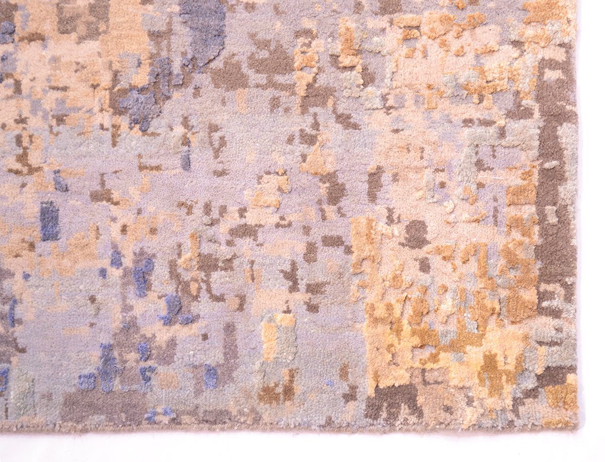 Corner of Abstract carpet with artisically placed silk highlights with high and low textures. Cotton warp threads are neatly bound  to uniform edges as selvedges. Natural breezey tones ...colours of the sky.