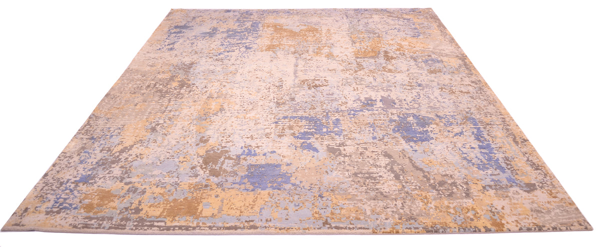 Overall view of handknotted Indian carpet with abstract design with matte wool and shiny soft golden light pure silk. Pure silk areas also handknotted and handcut in light blue and mid-blue tonalities.