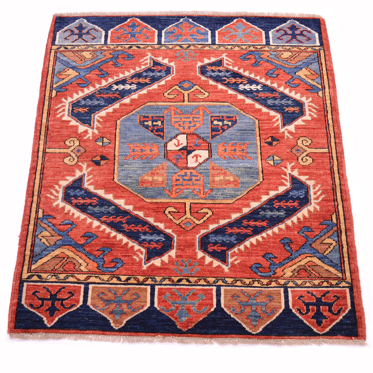 A square hand-woven area rug with a traditional geometric pattern in rust, blue, and beige, shown flat against a white background.
