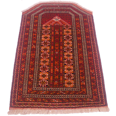 Hand-knotted unusual Turkoman Prayer Rug with asymmetric pattern in colours of rust-red, ochre-orange, midnight, green and cream. 